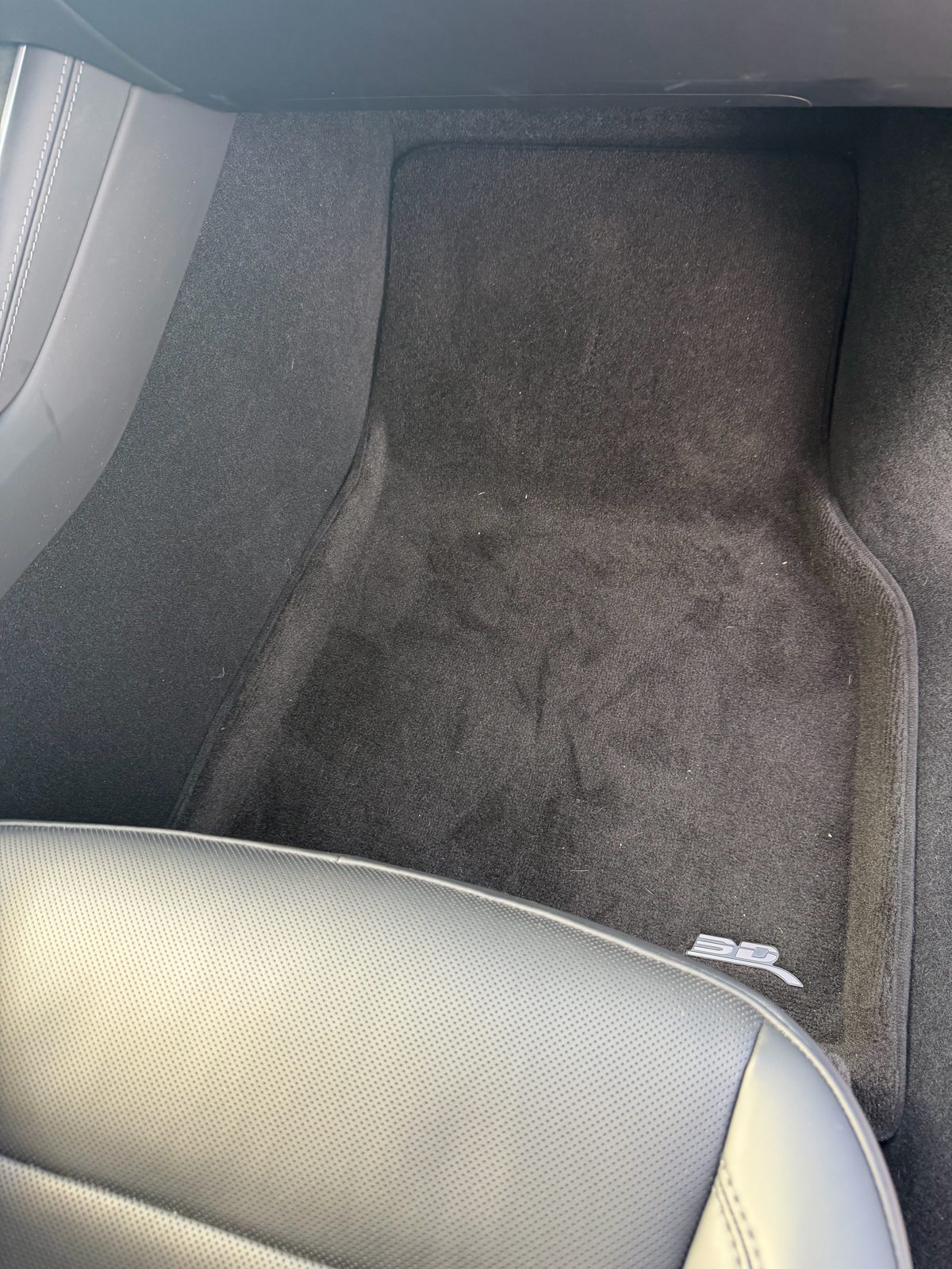 3D MAXpider carpet floor mat on the passenger side of the site owner's Model Y