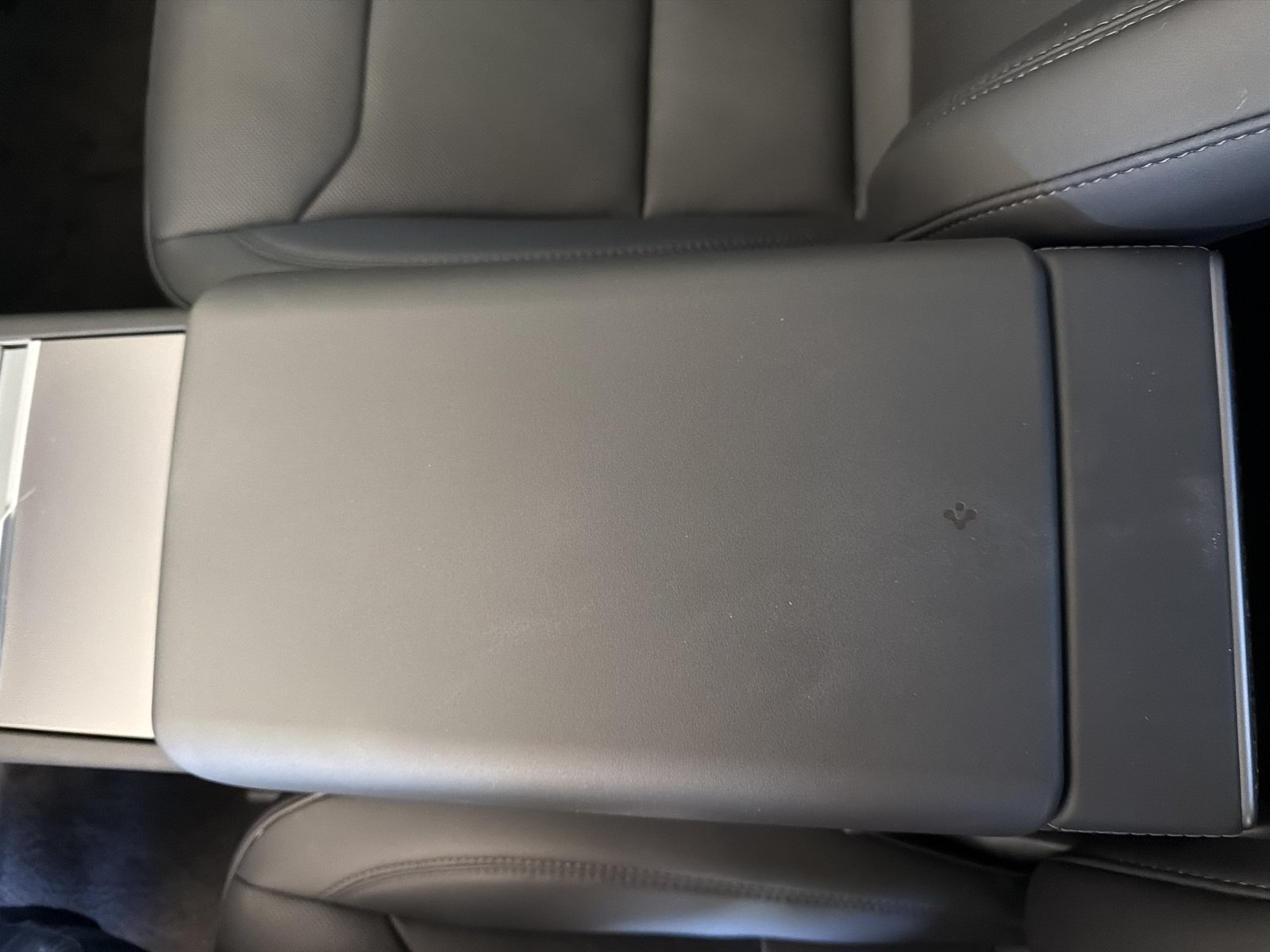 Spigen armrest cover on Kevin's 2026 Model Y Juniper
